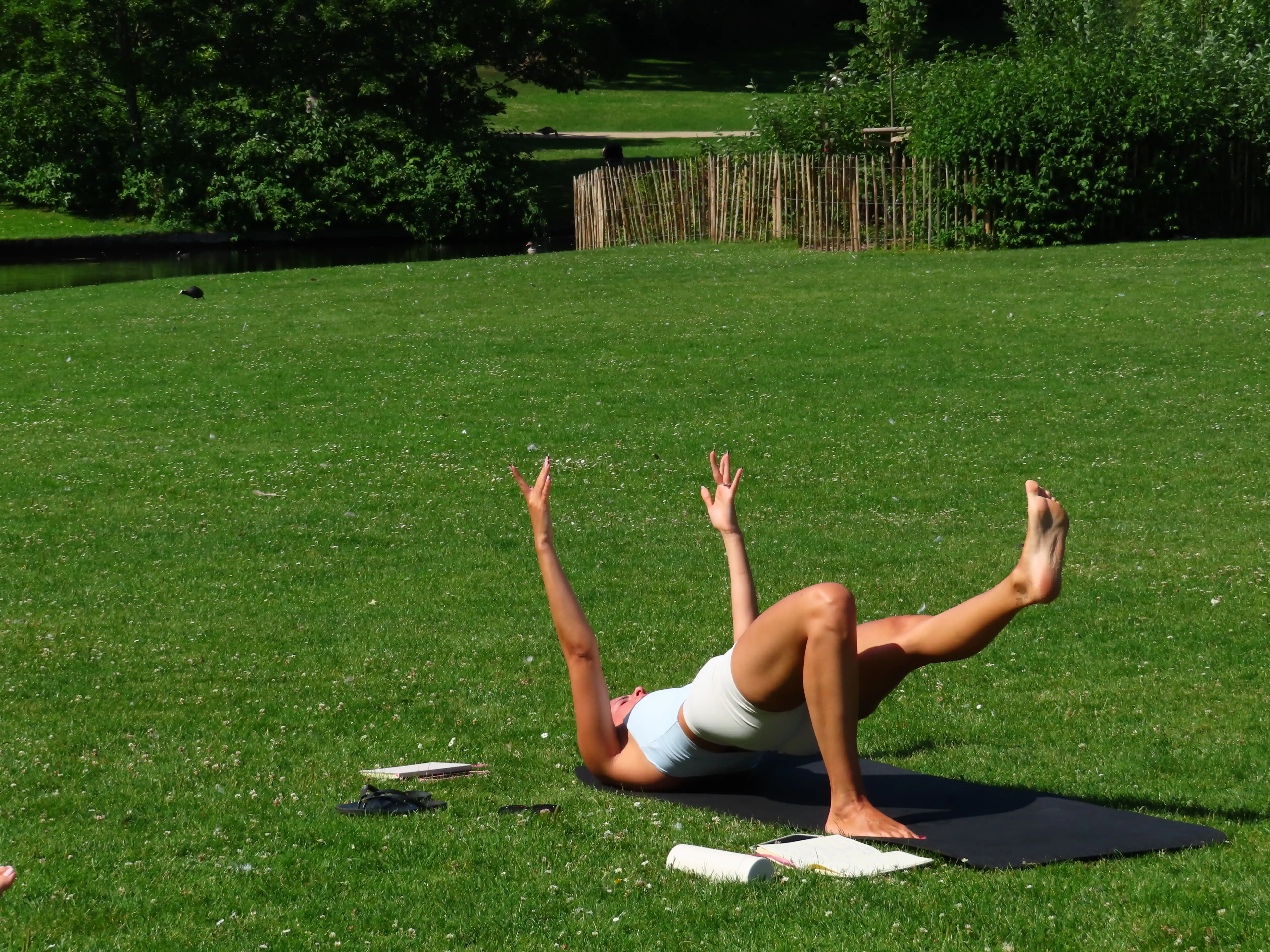A Forma member practising Pilates outdoors.